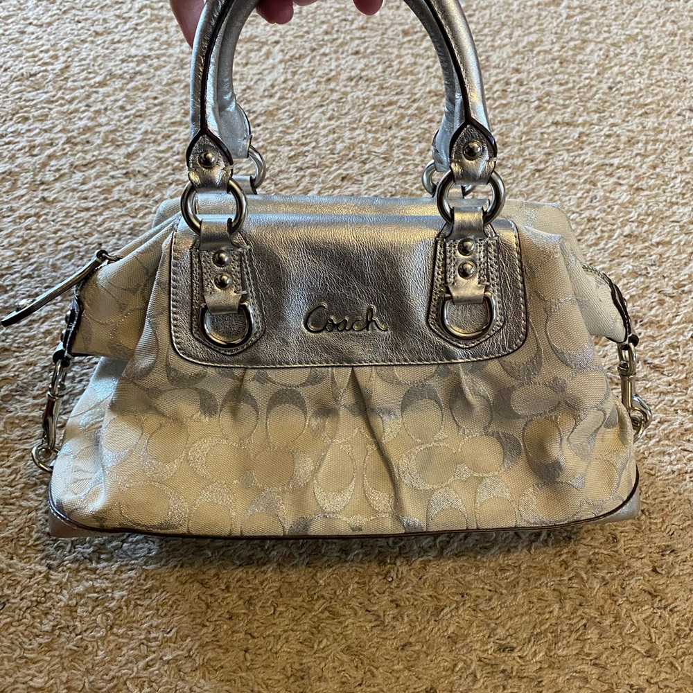 Coach silver purse.